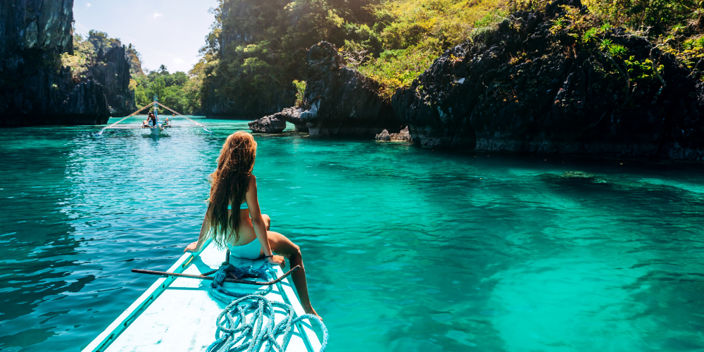 Aerial view of an idyllic island chain at sunset, showcasing breathtaking natural beauty and tranquil waters.