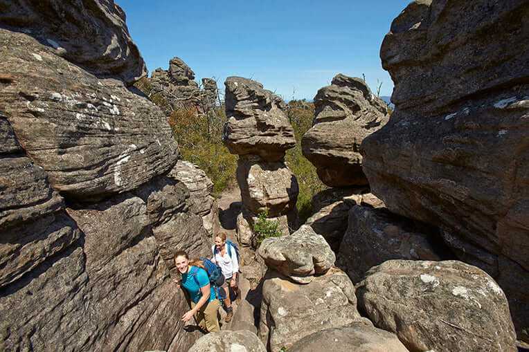 Hikers exploring the stunning rock formations in Central Grampians during a guided outdoor adventure.
