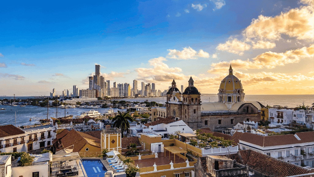 Sunset over Cartagena’s historic center and modern skyline, featured in the Colombia 17-Day Adventure - Travel Guide | Highlights Tour.