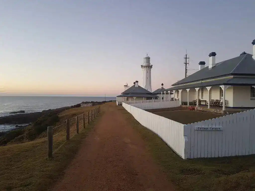 Historic lighthouse and cottages at Ben Boyd National Park, a key landmark on the 4-day guided Sapphire Coast Trek.