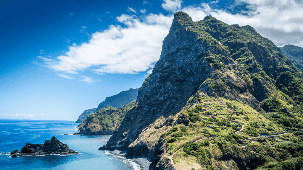 Dramatic coastal cliffs and winding hiking trails on Madeira Island, ideal for 6-days hiking Madeira’s trails and volcanic peaks.