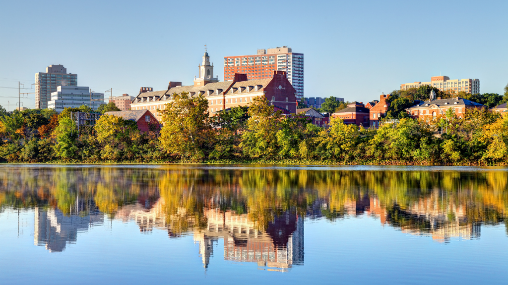 Urban skyline with historic architecture and river reflection, part of cultural stops on Newfoundland Tours Atlantic Edge travel package.