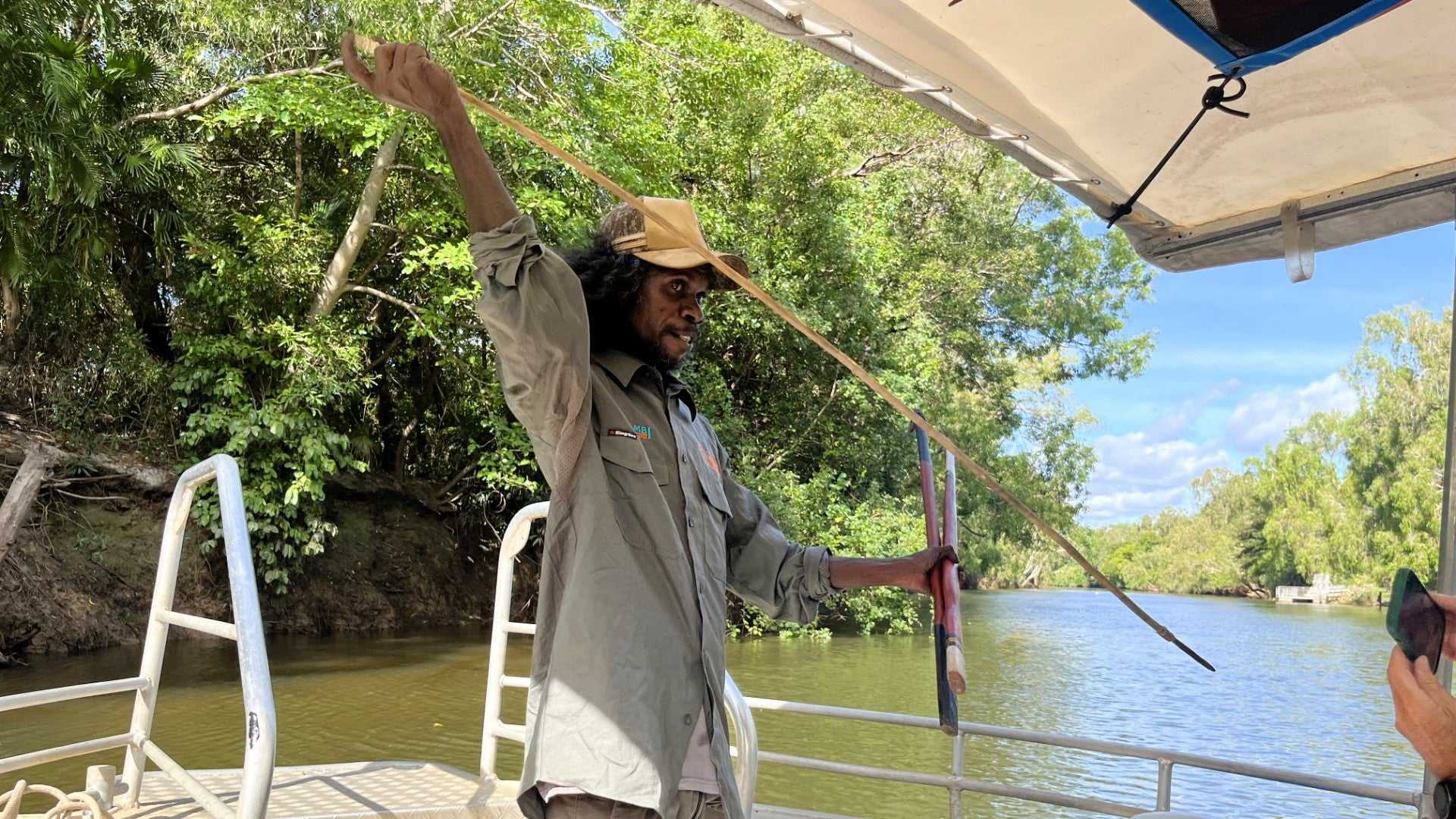Indigenous guide demonstrates spear fishing on Kakadu Katherine Gorge Tour | 4-Day Comfort Travel. Cultural cruise with traditional skills.