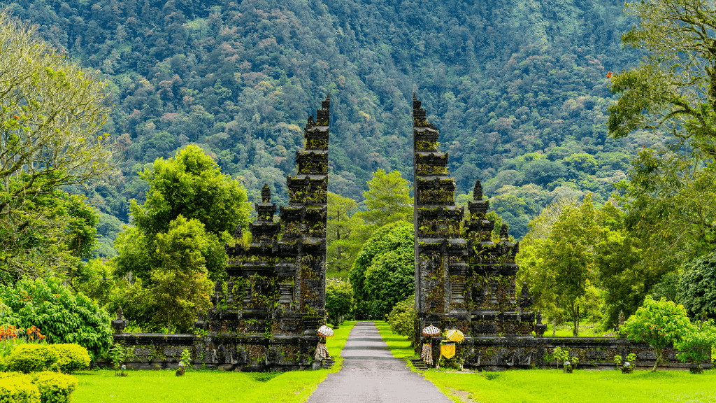 Handara Gate surrounded by tropical forest, a cultural landmark in Bali Komodo Lombok Tours - Explore Culture & Nature.