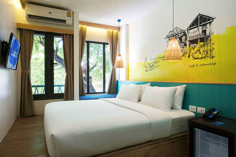 Modern hotel room with artistic decor, part of the accommodations on the Angkor to Islands 16-Day Tour - Khmer Culture to Thai Coasts.