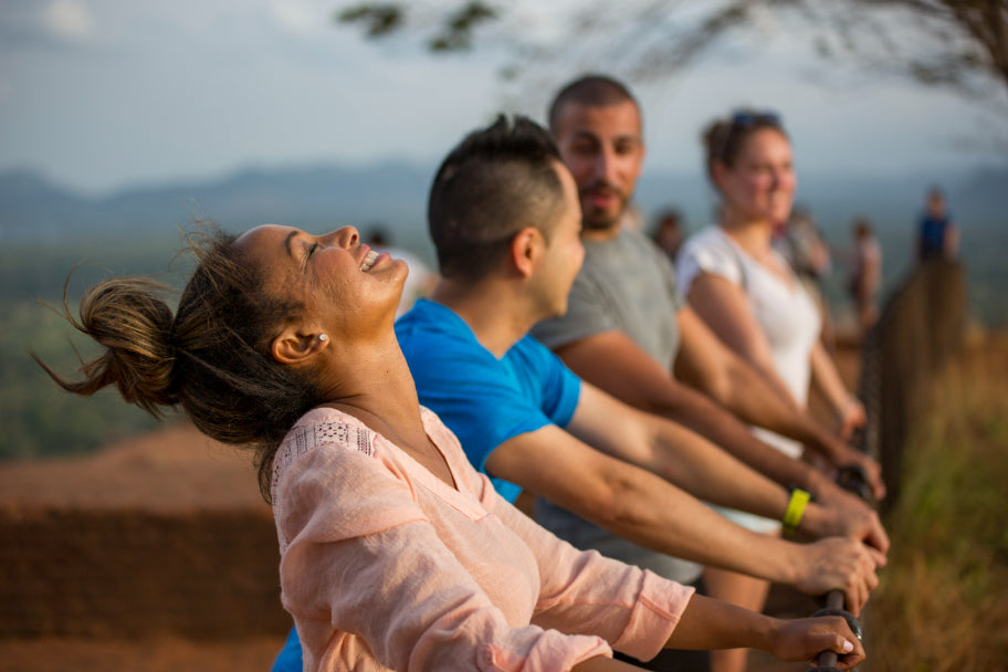 Group of travelers enjoying scenic view at Sigiriya Rock during Explore Sri Lanka - Land & Sea Tour Options. Ideal for cultural and nature lovers.