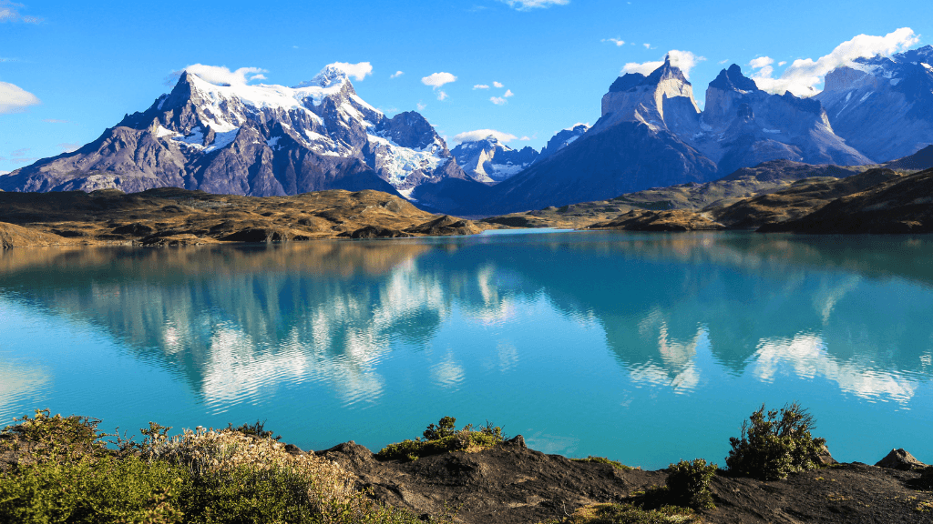 Turquoise lake reflecting Torres del Paine mountains on Patagonia Hiking Tours - Blue Heart Adventure | 9 Days. Scenic stop on the Turquoise Lakes Circuit.