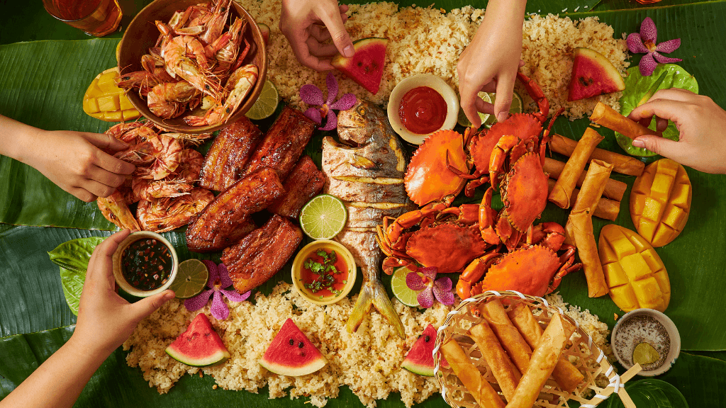 Seafood feast on banana leaves with shrimp, crab, and rice, part of Philippines Travel Tours - Icons of the Philippines culinary journey.