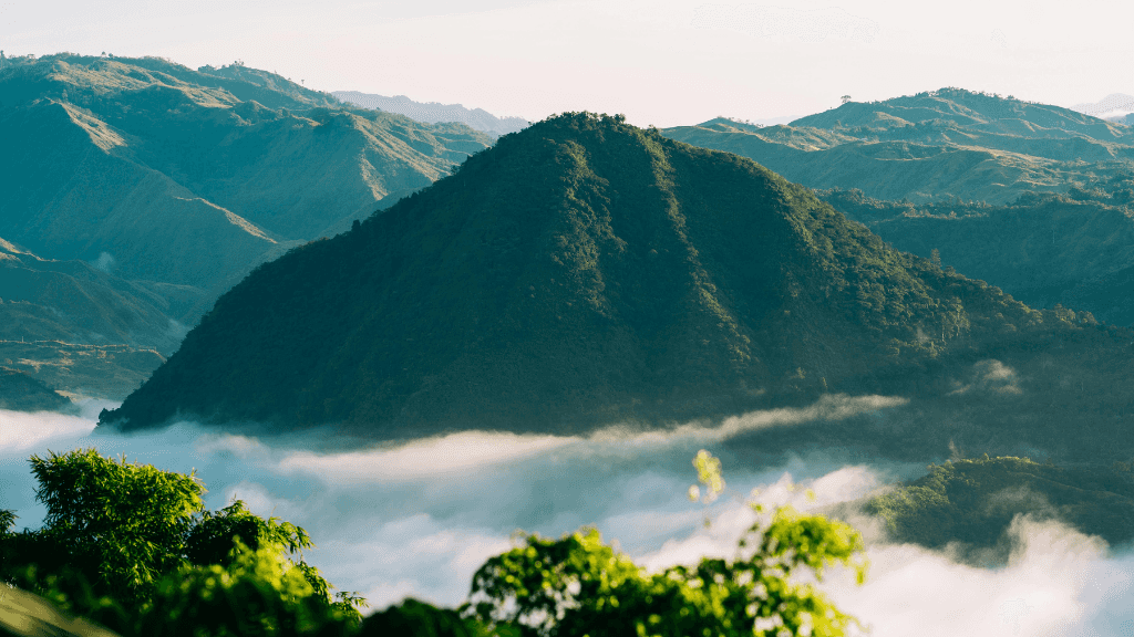 Lush mountain landscape with mist in the Philippines, scenic trekking in Philippines Travel Tours - Icons of the Philippines.