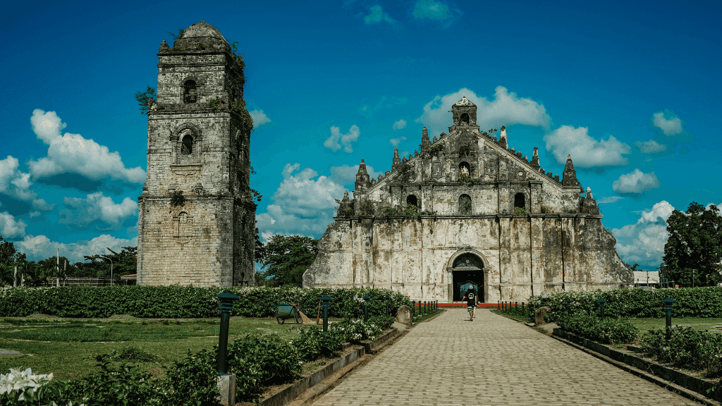Paoay Church with bell tower in Ilocos Norte, UNESCO site in Philippines Travel Tours - Icons of the Philippines | 10/14/23 Days.