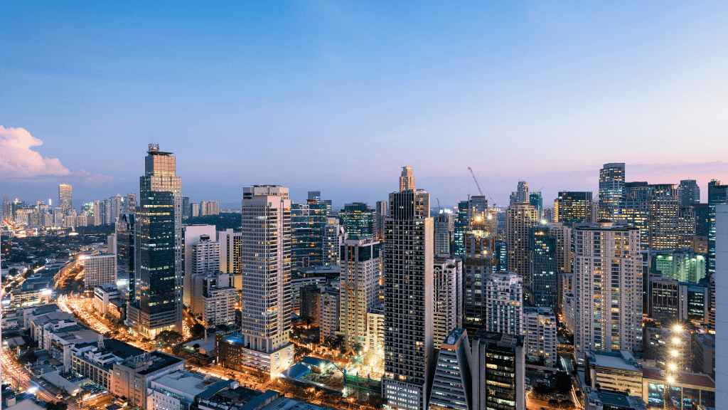 Modern skyline of Manila at dusk, urban exploration in Philippines Travel Tours - Icons of the Philippines | 10/14/23 Days.