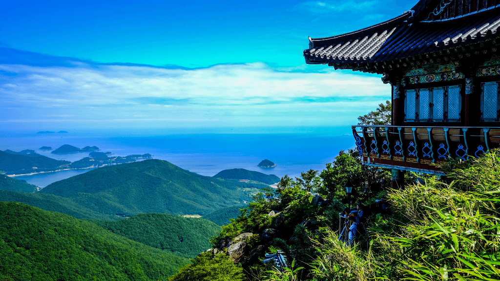 Temple perched on a mountain overlooking the sea, offering breathtaking views during the South Korea cultural highlights travel experience.