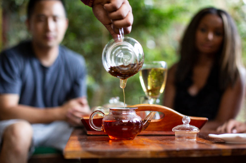 Tea being poured during tasting session in Sri Lanka. Explore Sri Lanka - Land & Sea Tour Options includes culinary and tea culture experiences.