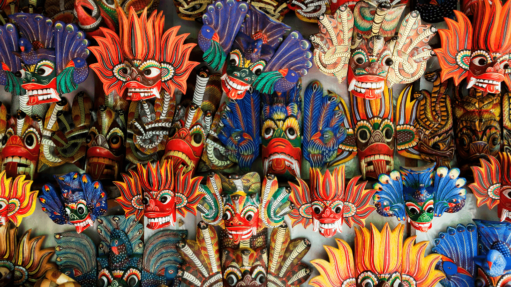 Colorful traditional Sri Lankan masks on display, part of the cultural highlights in the 12-day spice gardens and coast tour.