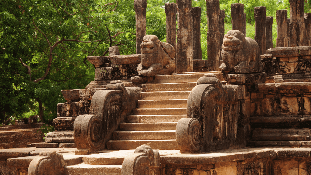 Ancient stone ruins with lion statues in Polonnaruwa, part of the cultural exploration on the 12-day Sri Lanka tour.