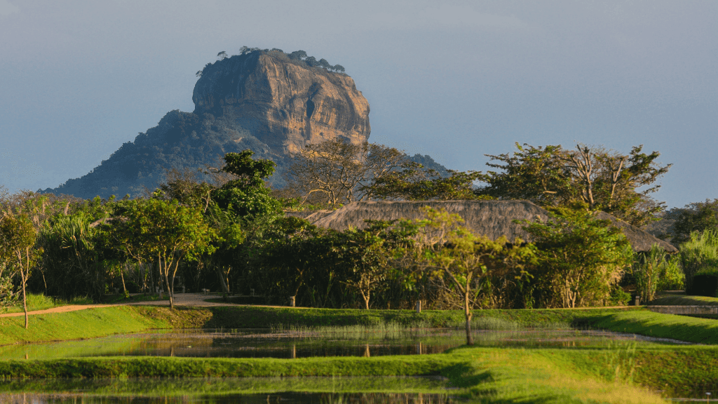 Iconic Sigiriya rock fortress rising above lush landscape, a must-see on the 12-day Sri Lanka spice gardens and coast tour.