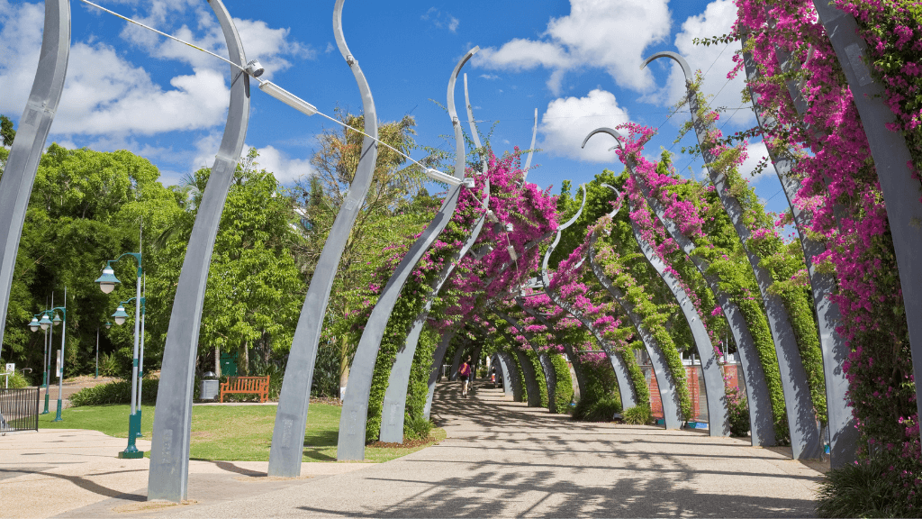 South Bank Parklands in Brisbane with floral archway, featured on East Coast Australia tour. Final stop on 8-day Sydney to Brisbane trip.