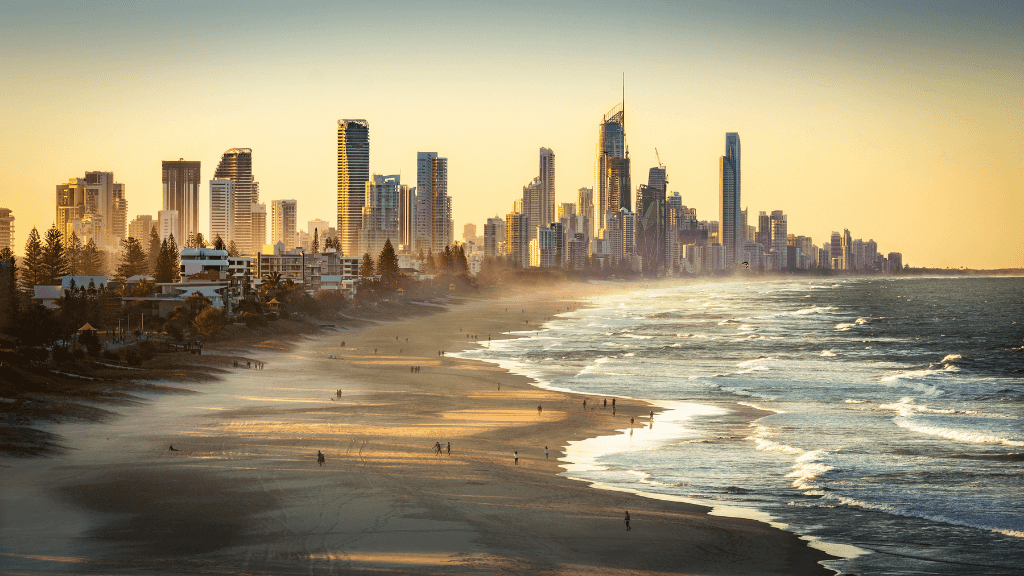 Gold Coast skyline at sunset, featured on East Coast Australia tour. Beach city stop on 8-day Sydney to Brisbane itinerary.