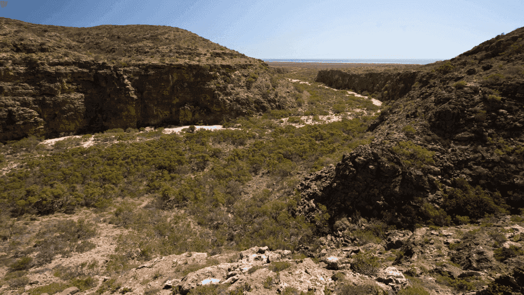 Wide view of rocky gorge and dry riverbed in Cape Range National Park, explored during the 4-Day Ningaloo Kayak Expedition.