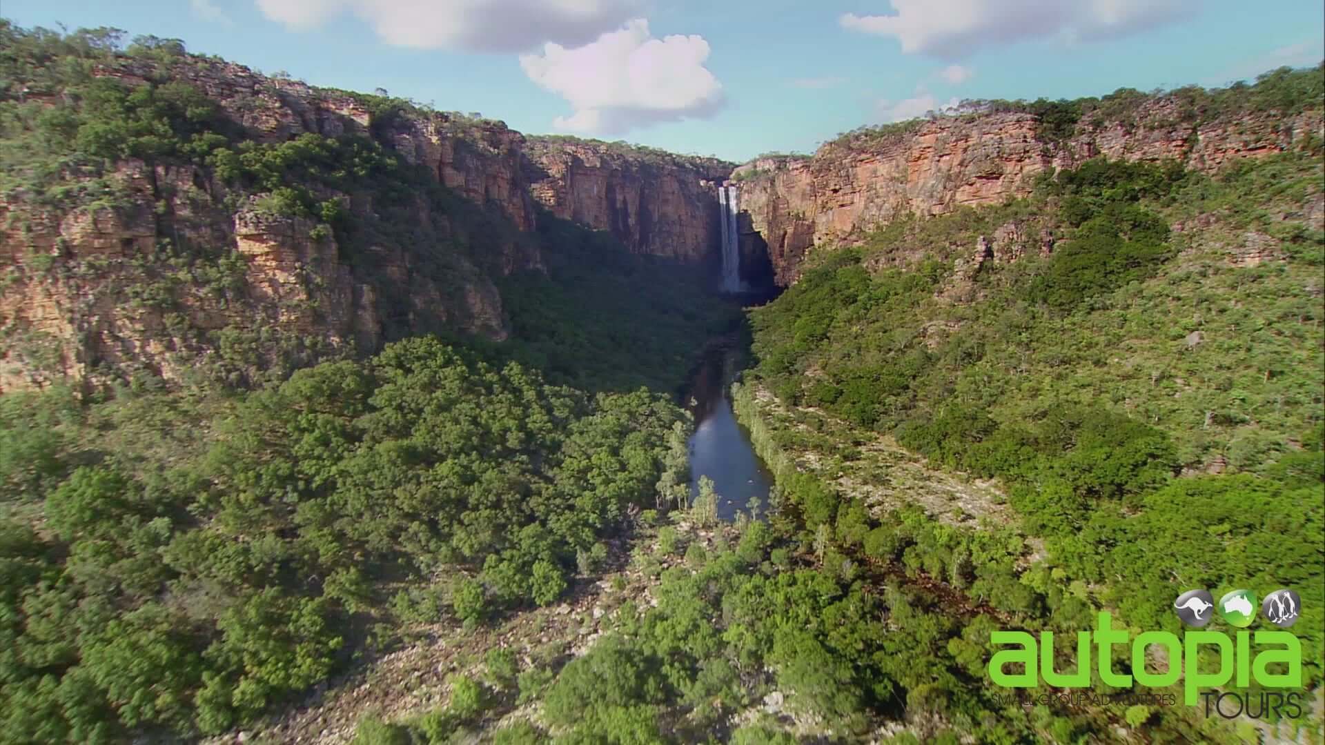 Aerial view of Jim Jim Falls in Kakadu National Park on 5-Day Top End 4WD Camping Safari. Lush green cliffs and waterfall scenery.