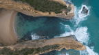 Aerial view of the stunning coastline near the Twelve Apostles showcasing cliffs and turquoise waters.