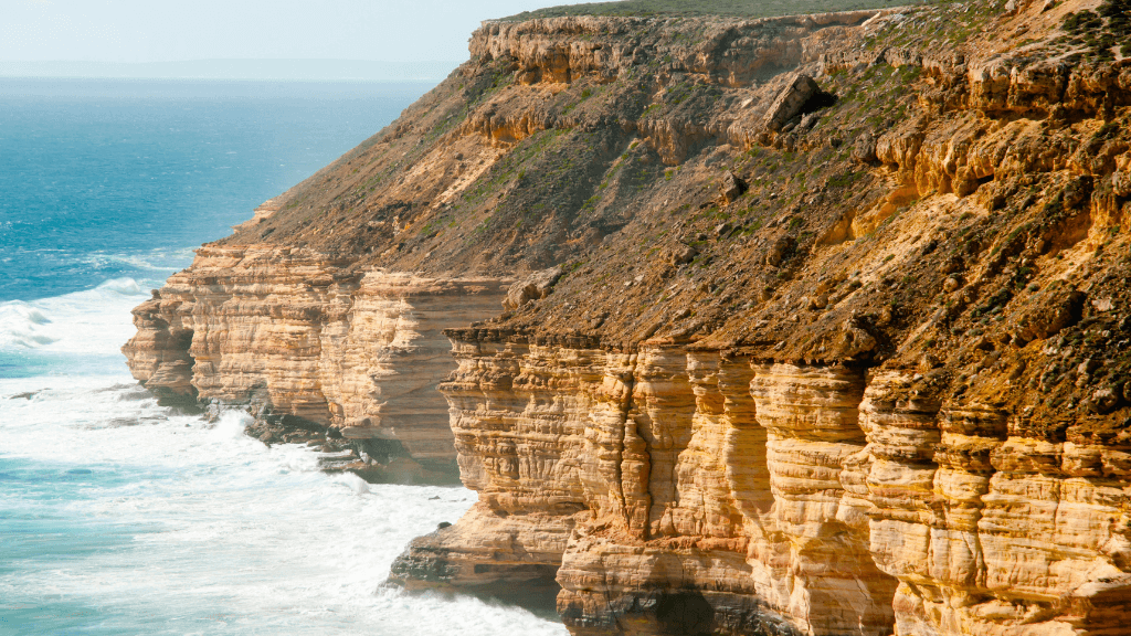 Dramatic coastal cliffs at Kalbarri National Park on West Coast Road Trip. Ocean views and hiking destination in Western Australia.