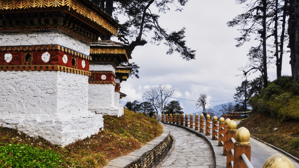 108 memorial chortens at Dochula Pass on the Trans Bhutan Trail, a spiritual and scenic highlight of the journey.