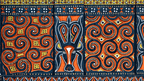 Colorful Torajan textile patterns with intricate motifs, showcasing local craftsmanship on the Soul of Sulawesi - Tana Toraja Culture Tour.