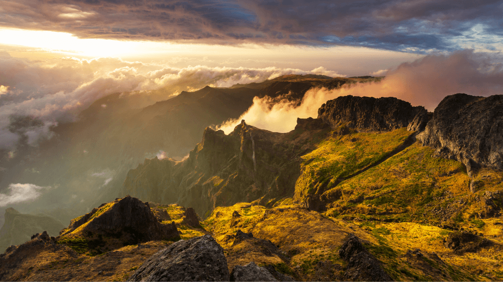 Golden sunset over Madeira’s volcanic mountain range, part of the scenic 6-days hiking Madeira’s trails tour.