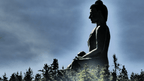 Giant Buddha Dordenma statue overlooking forested hills, a spiritual site on the Trans Bhutan Trail adventure.
