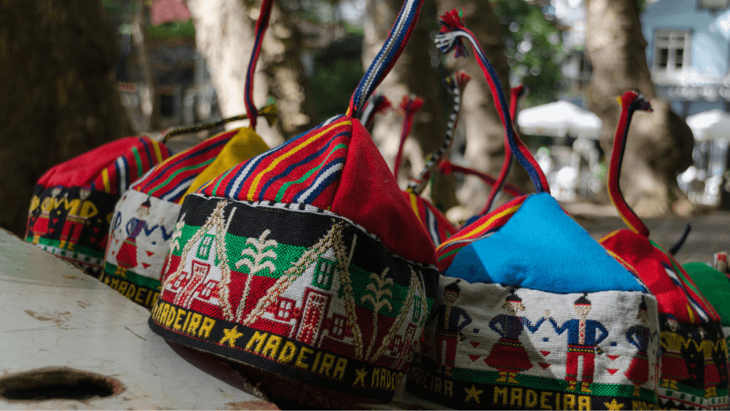 Traditional Madeira hats with colorful embroidery, a cultural souvenir from the 6-days hiking Madeira’s trails trip.
