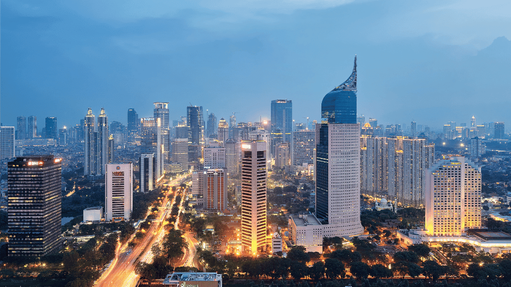 Jakarta skyline at dusk, a potential starting point for the 7-day Borneo orangutan and river wildlife tour.