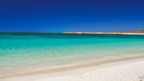 Turquoise beach with calm waters along the Ningaloo Coast, a relaxing stop on the 3-Day Kayak & Snorkel Safari.