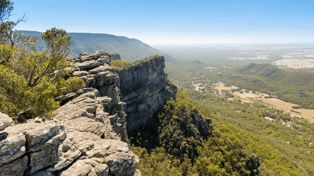 Stunning view from the ridge in the Northern Grampians, showcasing rugged cliffs and lush valleys.