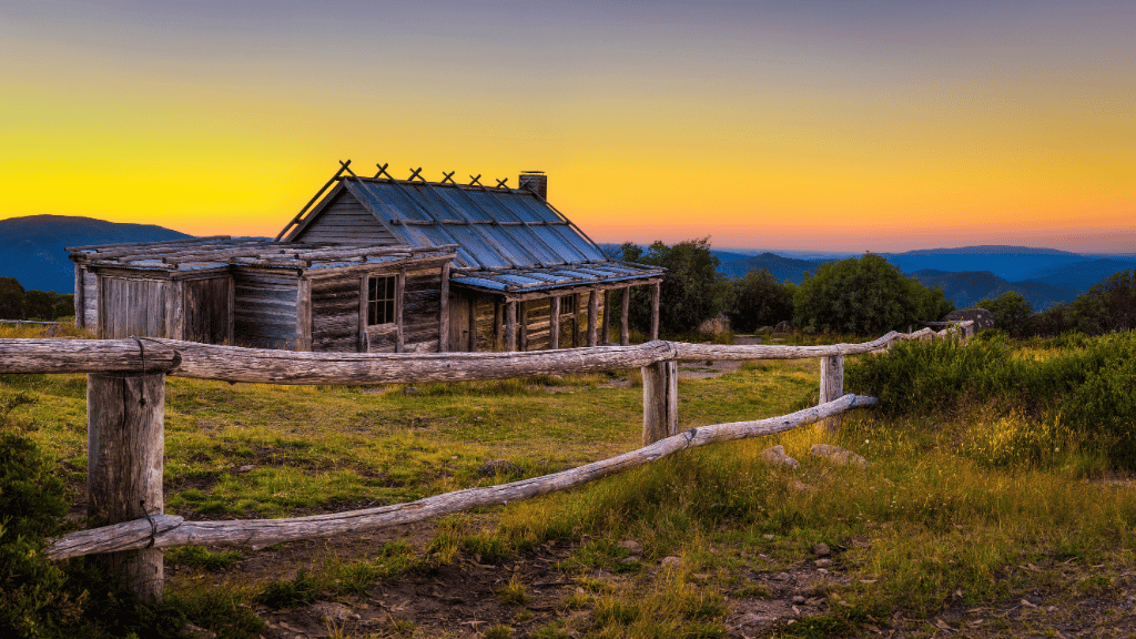 Rustic cabin at sunset in Victoria's High Country, perfect for adventure tours and outdoor travel.