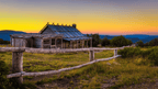 Rustic cabin at sunset in Victoria's High Country, perfect for adventure tours and outdoor travel.