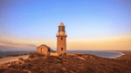 Historic lighthouse overlooking Ningaloo Coast at sunset, a scenic stop on the 3-Day Kayak & Snorkel Safari adventure.