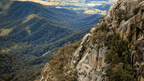 Breathtaking view of rugged escarpments and lush valleys in Victoria's High Country, perfect for outdoor adventure.