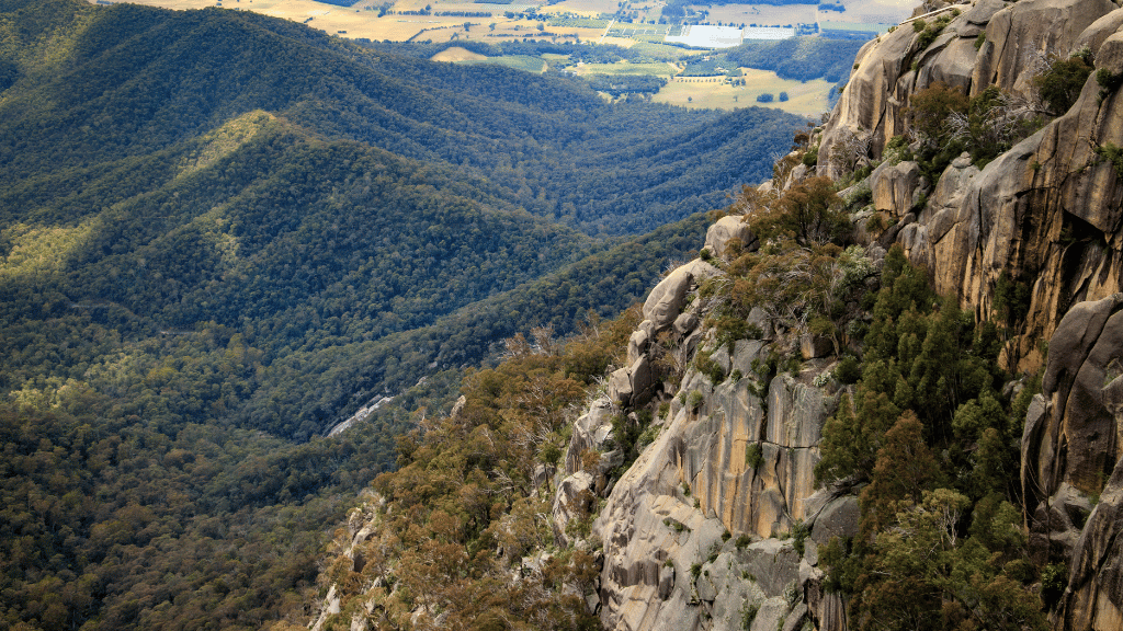 Breathtaking view of rugged escarpments and lush valleys in Victoria's High Country, perfect for outdoor adventure.