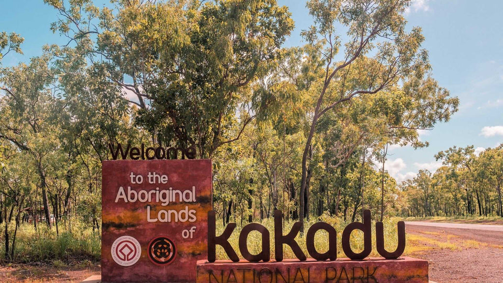Entrance sign to Kakadu National Park on Kakadu Katherine Gorge Tour | 4-Day Comfort Travel. Gateway to Aboriginal lands and nature.