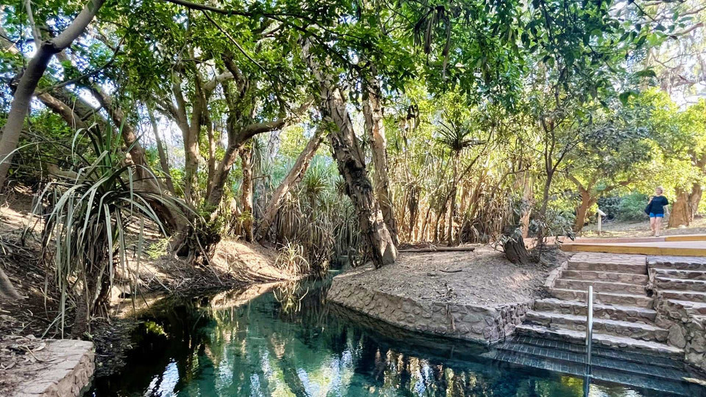 Natural thermal spring surrounded by forest on Kakadu Katherine Gorge Tour | 4-Day Comfort Travel. Relaxing stop in tropical setting.