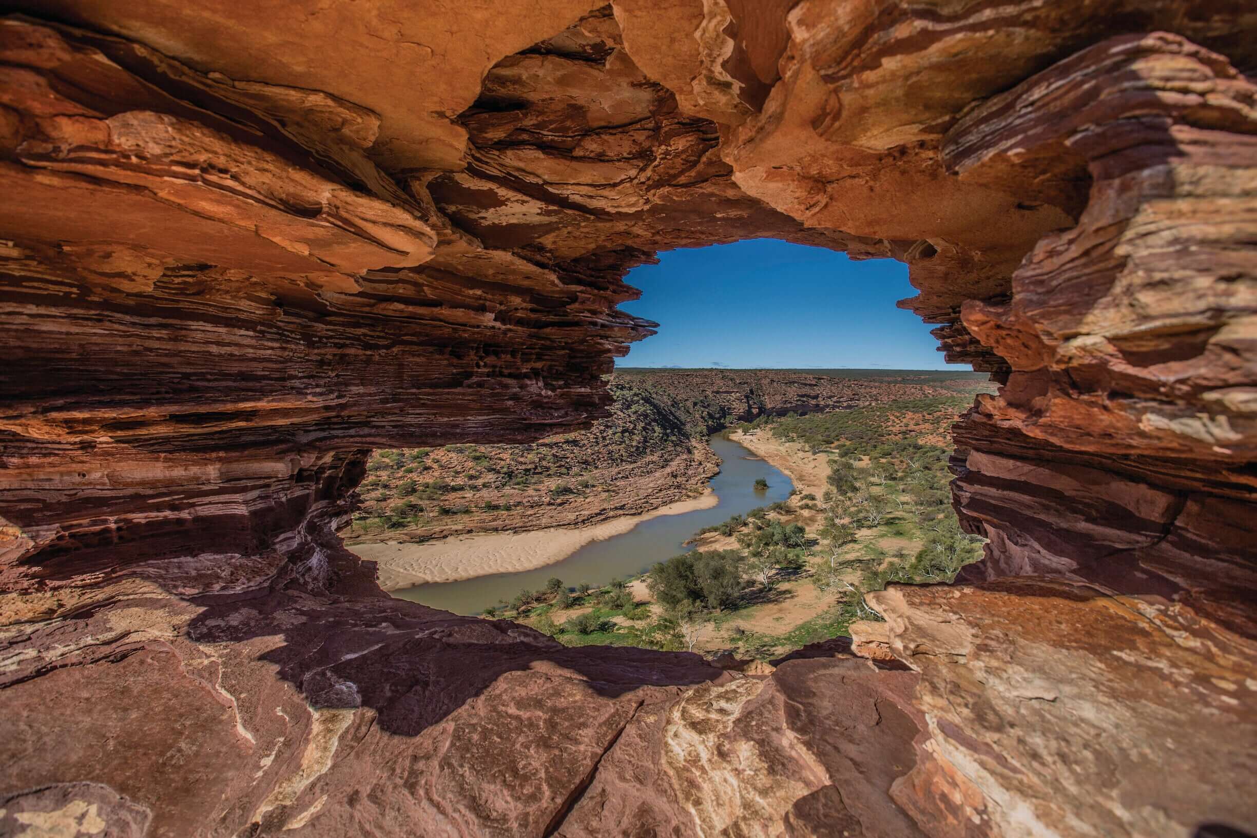View through Nature’s Window rock formation in Kalbarri National Park on West Coast Road Trip. Iconic photo spot in Western Australia.
