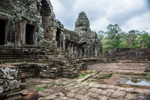 Ruins of Bayon Temple in Cambodia, part of the historical sites on the Angkor to Islands 16-Day Tour - Khmer Culture to Thai Coasts.
