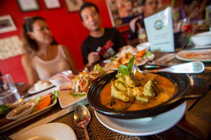 Traditional Thai dishes served at a group meal, part of the foodie experiences on the Angkor to Islands 16-Day Tour - Khmer Culture to Thai Coasts.
