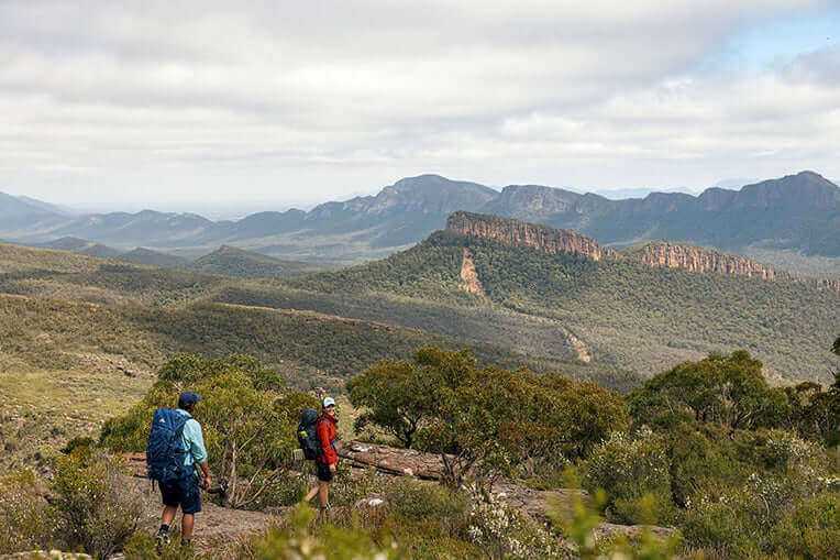 Two hikers exploring the stunning landscapes of the Central Grampians during a guided adventure tour.