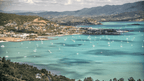 Aerial view of Airlie Beach marina, gateway to Whitsundays on East Coast Adventure 14/16-Day Small-Group Tour. Coastal town with turquoise waters.