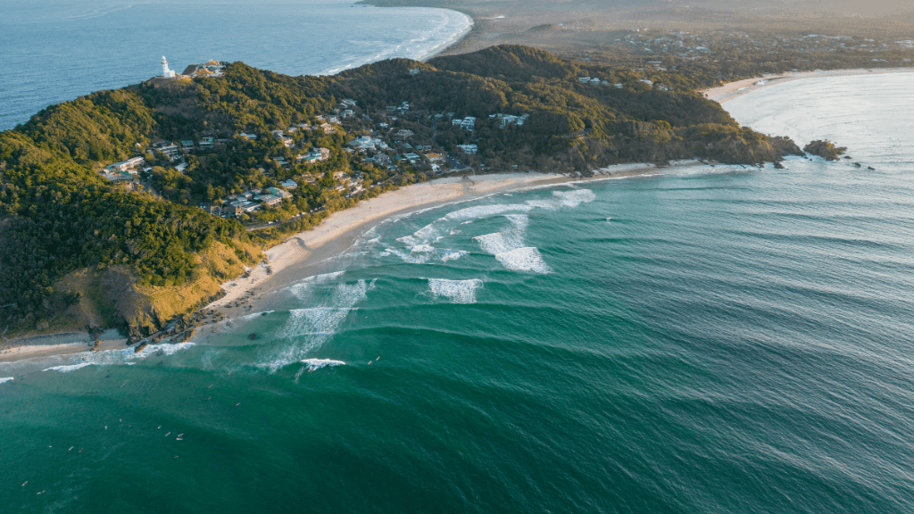 Aerial view of Byron Bay and lighthouse on East Coast Adventure 14/16-Day Small-Group Tour. Iconic surf town and coastal scenery.