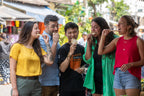 Travelers enjoying street food tasting with a local guide in Vietnam. Culinary adventure on Vietnam Hiking and Cycling Tour.