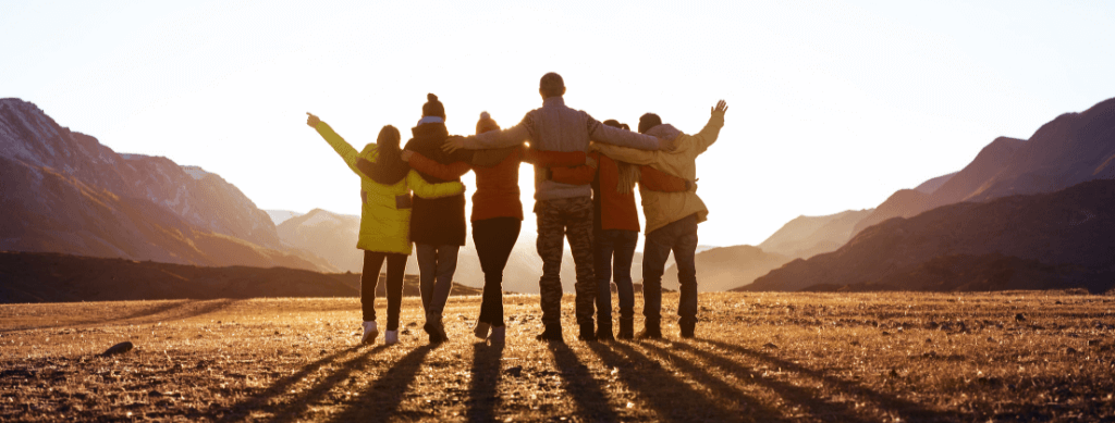 A group hugging on tour 