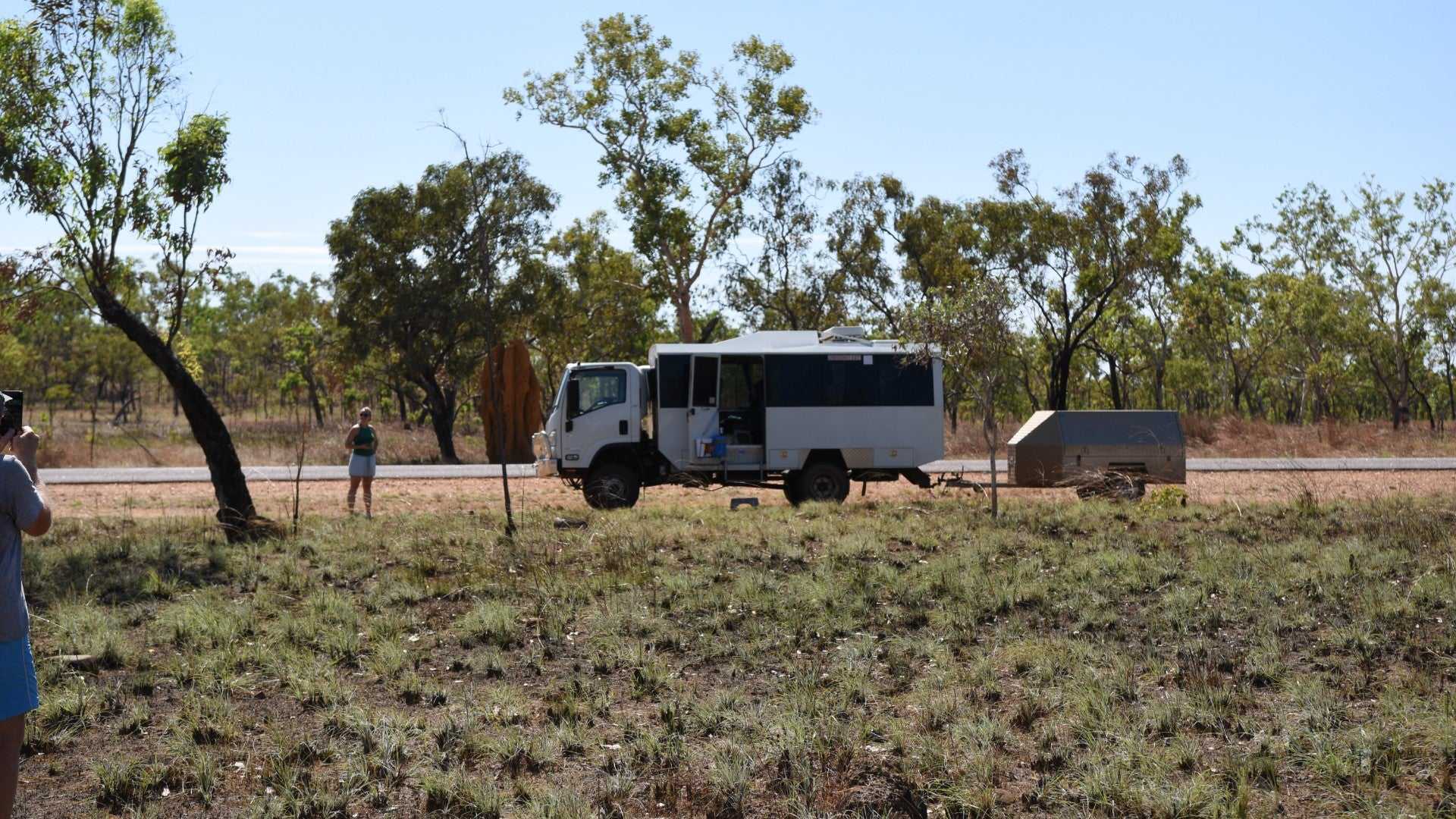 Tour vehicle parked in outback at Kakadu Litchfield Camping Adventure - 3-Day Tour. Rugged transport for remote travel experience.